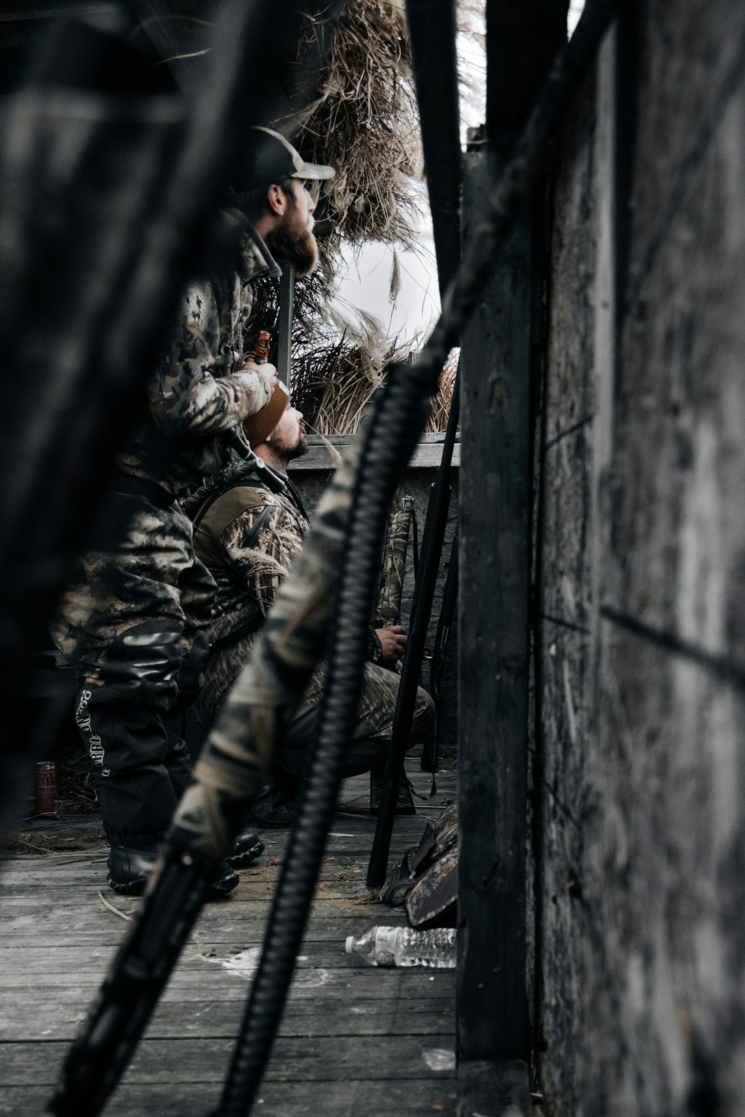 a-man-sitting-on-a-bench-next-to-a-pile-of-hay-vnfyzeyaofo